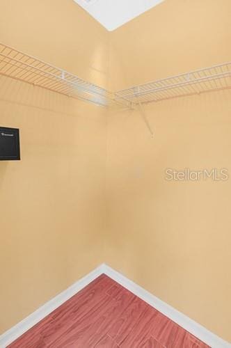7 Flint Pl, Palm Coast, FL 32137 - walk in closet featuring dark wood-style flooring