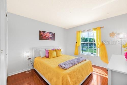 7 Flint Pl, Palm Coast, FL 32137 - bedroom featuring wood finished floors and baseboards