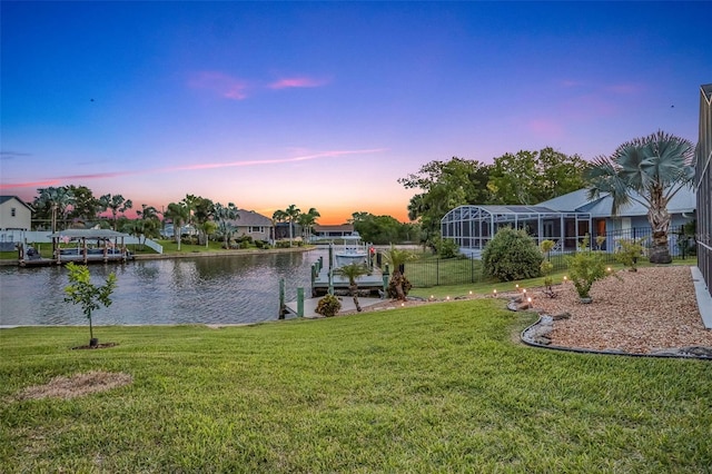 33 Crystal Bay Ct, Palm Coast, FL 32137 - yard at dusk with a water view