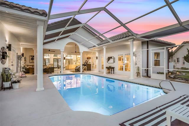 33 Crystal Bay Ct, Palm Coast, FL 32137 - swimming pool featuring french doors, an outdoor hangout area, a patio area, ceiling fan, and glass enclosure