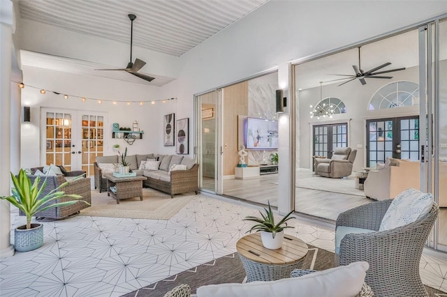 33 Crystal Bay Ct, Palm Coast, FL 32137 - living room with french doors, a ceiling fan, and a towering ceiling