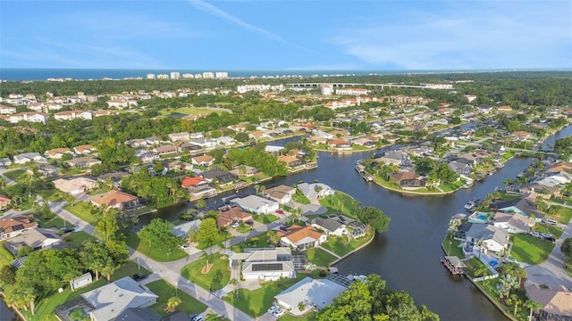 33 Crystal Bay Ct, Palm Coast, FL 32137 - aerial view of property and surrounding area featuring a large body of water and nearby suburban area