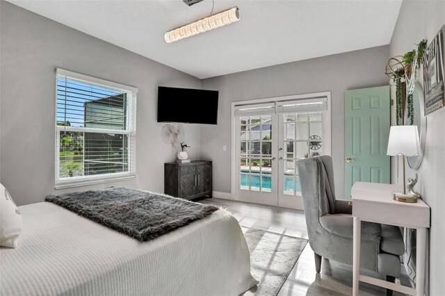 33 Crystal Bay Ct, Palm Coast, FL 32137 - bedroom featuring french doors, access to outside, and wood finished floors