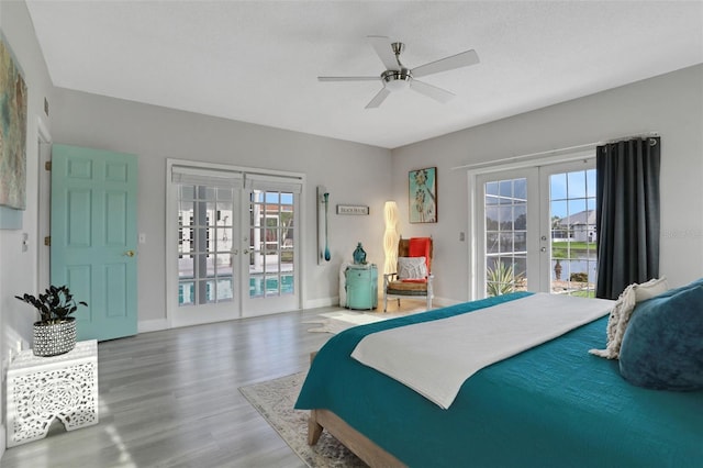 33 Crystal Bay Ct, Palm Coast, FL 32137 - bedroom featuring french doors, access to outside, wood finished floors, and ceiling fan
