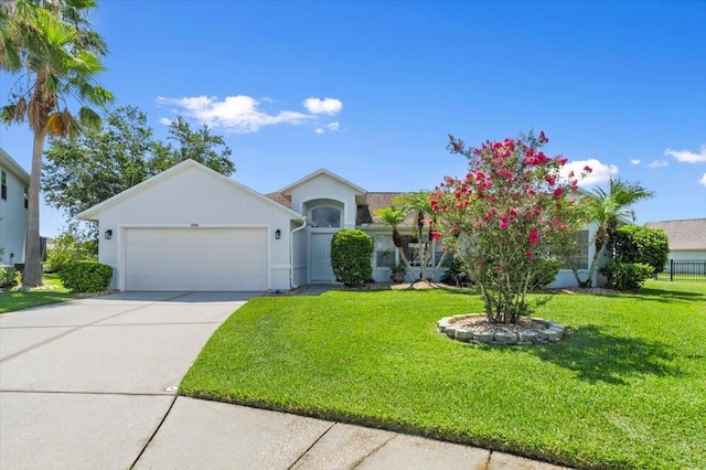 1904 Rouzbeh Ct, Port Orange, FL 32128 - view of front of property with an attached garage, stucco siding, a front lawn, and driveway