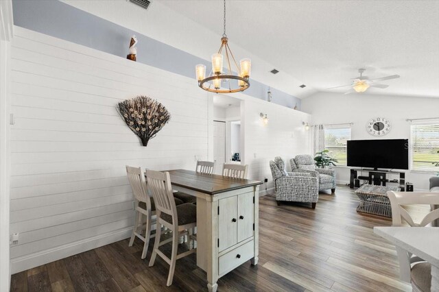 1904 Rouzbeh Ct, Port Orange, FL 32128 - dining area featuring a chandelier, lofted ceiling, dark wood-type flooring, and a ceiling fan