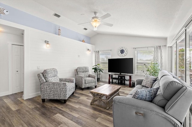1904 Rouzbeh Ct, Port Orange, FL 32128 - living room with lofted ceiling, ceiling fan, a textured ceiling, and wood finished floors