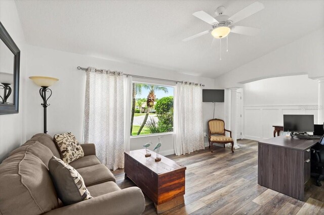 1904 Rouzbeh Ct, Port Orange, FL 32128 - living room with wood finished floors, vaulted ceiling, ornate columns, a ceiling fan, and a desk