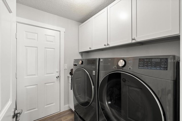 1904 Rouzbeh Ct, Port Orange, FL 32128 - laundry room with cabinet space, washer and dryer, dark wood finished floors, and a textured ceiling