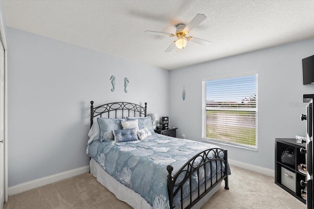 1904 Rouzbeh Ct, Port Orange, FL 32128 - bedroom featuring carpet flooring, a textured ceiling, and a ceiling fan