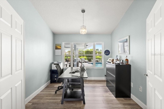 1904 Rouzbeh Ct, Port Orange, FL 32128 - office with dark wood-style flooring and a textured ceiling
