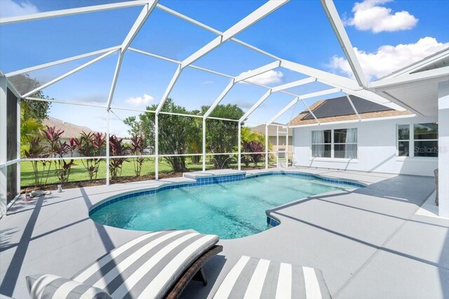 1904 Rouzbeh Ct, Port Orange, FL 32128 - swimming pool featuring a patio and glass enclosure