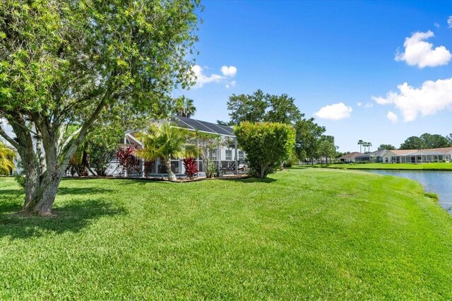 1904 Rouzbeh Ct, Port Orange, FL 32128 - view of grassy yard featuring a water view and glass enclosure