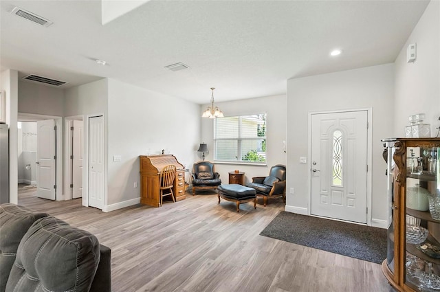 9 Elder Pl, Palm Coast, FL 32164 - foyer featuring light wood-style flooring, a chandelier, and recessed lighting