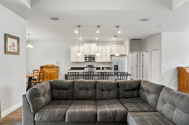 9 Elder Pl, Palm Coast, FL 32164 - living area featuring wood finished floors and recessed lighting