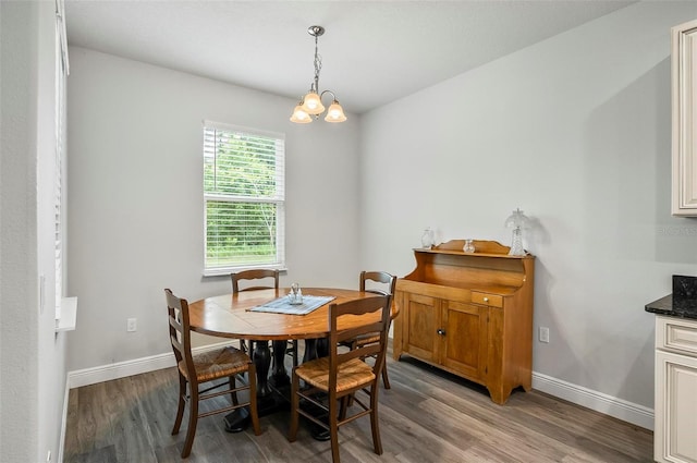 9 Elder Pl, Palm Coast, FL 32164 - dining room featuring light wood finished floors and a chandelier