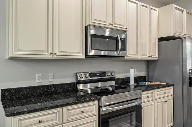 9 Elder Pl, Palm Coast, FL 32164 - kitchen with stainless steel appliances and dark stone counters