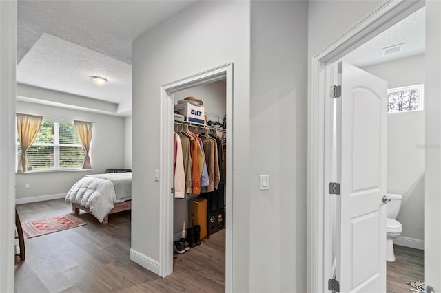 9 Elder Pl, Palm Coast, FL 32164 - hallway with wood finished floors and a textured ceiling