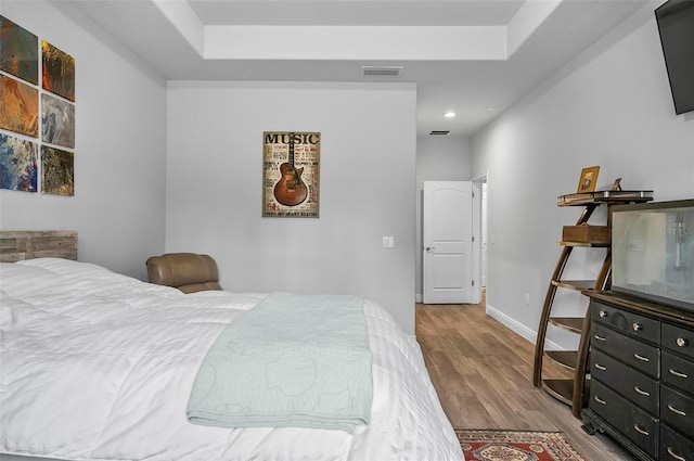 9 Elder Pl, Palm Coast, FL 32164 - bedroom featuring wood finished floors, recessed lighting, and a raised ceiling