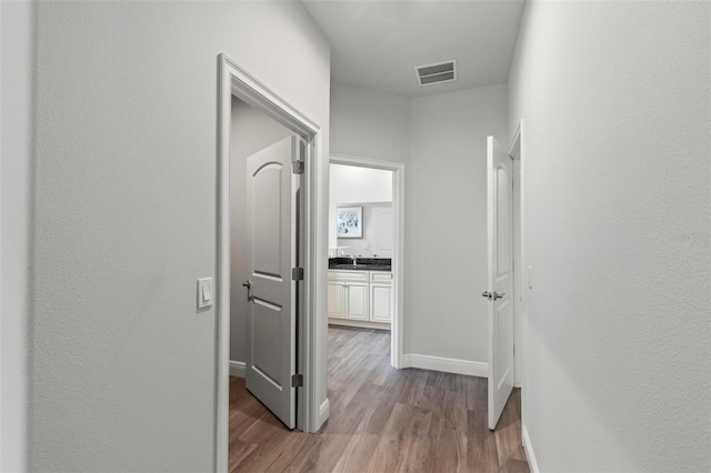 9 Elder Pl, Palm Coast, FL 32164 - hall featuring baseboards and wood finished floors