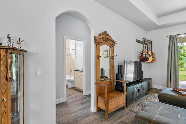 9 Elder Pl, Palm Coast, FL 32164 - hall featuring arched walkways and wood finished floors