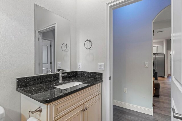 9 Elder Pl, Palm Coast, FL 32164 - bathroom with wood finished floors and vanity