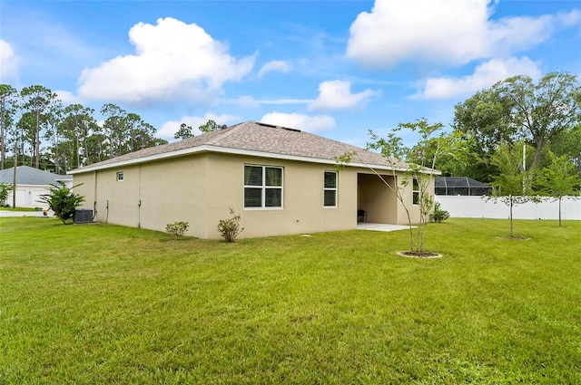 9 Elder Pl, Palm Coast, FL 32164 - back of house with stucco siding, a shingled roof, and a patio