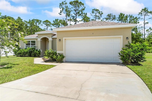 9 Elder Pl, Palm Coast, FL 32164 - view of front of home featuring stucco siding, concrete driveway, and a front yard