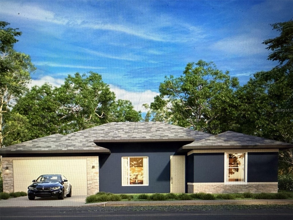 5 Edmond Pl, Palm Coast, FL 32164 - view of front of house with a garage, concrete driveway, and a shingled roof