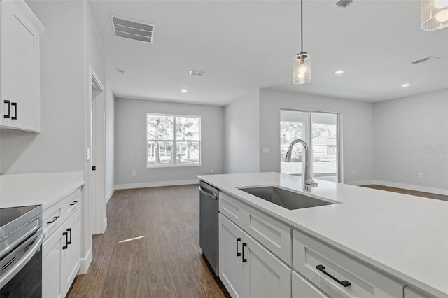 1 Barbera Ln, Palm Coast, FL 32137 - kitchen featuring plenty of natural light, light countertops, dark wood-style floors, and recessed lighting