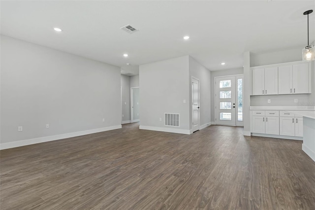 1 Barbera Ln, Palm Coast, FL 32137 - unfurnished living room featuring dark wood finished floors and recessed lighting