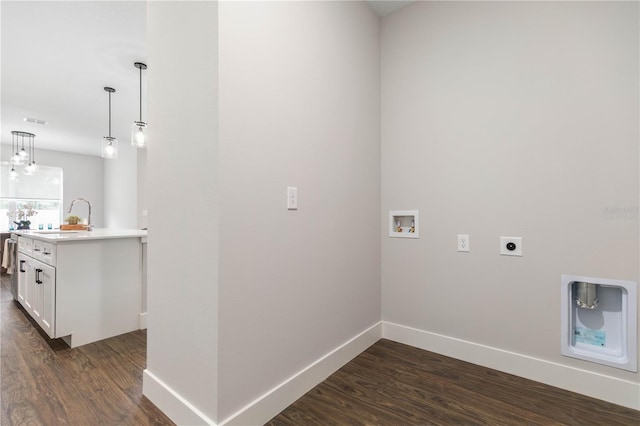 1 Barbera Ln, Palm Coast, FL 32137 - laundry room featuring electric dryer hookup, washer hookup, and dark wood-type flooring
