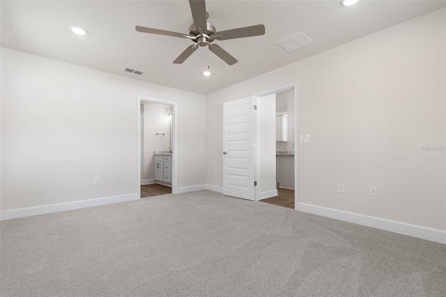 16 Service Tree Pl, Palm Coast, FL 32164 - unfurnished bedroom featuring carpet flooring, recessed lighting, ensuite bath, and a ceiling fan