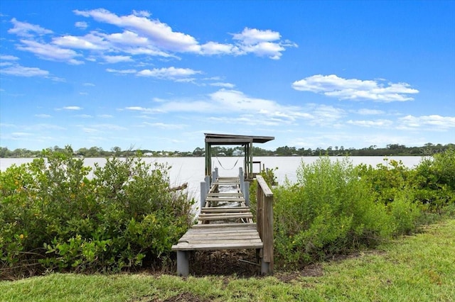 2940 Sunset Dr, New Smyrna Beach, FL 32168 - dock featuring a water view and boat lift