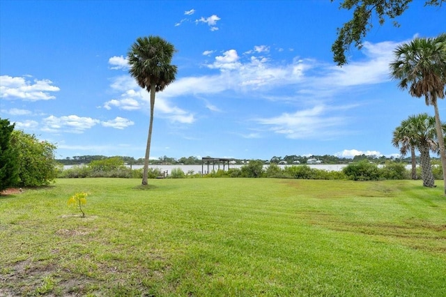 2940 Sunset Dr, New Smyrna Beach, FL 32168 - view of grassy yard featuring a water view