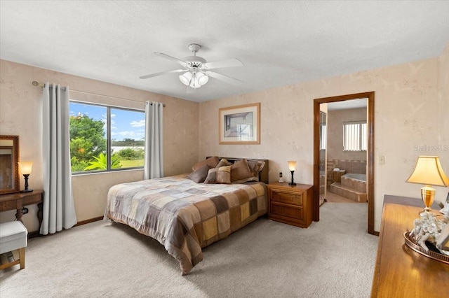 2940 Sunset Dr, New Smyrna Beach, FL 32168 - bedroom featuring multiple windows, light colored carpet, and ceiling fan