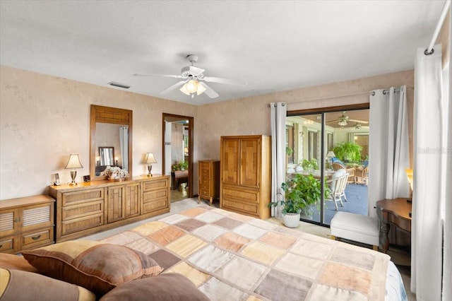 2940 Sunset Dr, New Smyrna Beach, FL 32168 - bedroom featuring access to exterior and a ceiling fan