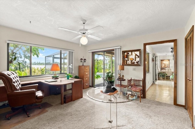2940 Sunset Dr, New Smyrna Beach, FL 32168 - office with carpet flooring, a textured ceiling, and a ceiling fan