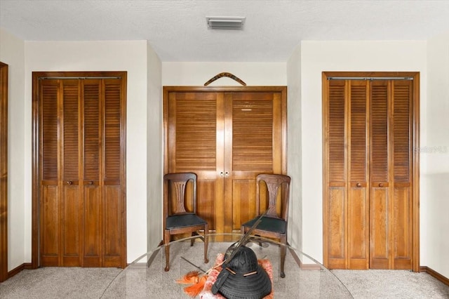 2940 Sunset Dr, New Smyrna Beach, FL 32168 - sitting room featuring carpet and baseboards