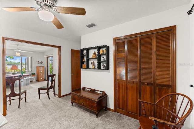 2940 Sunset Dr, New Smyrna Beach, FL 32168 - sitting room featuring ceiling fan and light colored carpet