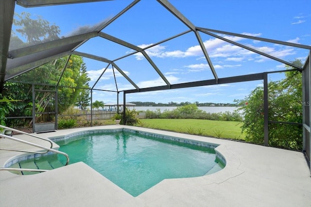 2940 Sunset Dr, New Smyrna Beach, FL 32168 - outdoor pool featuring a water view, a lawn, glass enclosure, and a patio