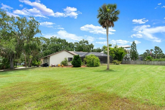 2940 Sunset Dr, New Smyrna Beach, FL 32168 - view of yard featuring a lanai