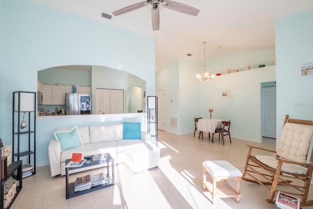 47 Summerwind Cir, Palm Coast, FL 32137 - living area with high vaulted ceiling, a chandelier, arched walkways, ceiling fan, and light tile patterned floors
