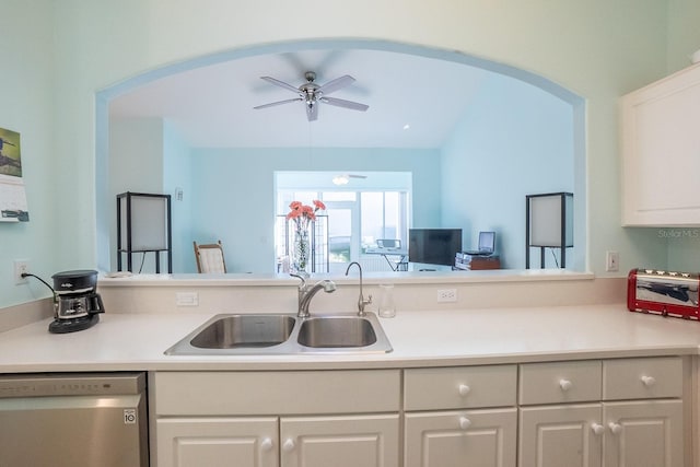 47 Summerwind Cir, Palm Coast, FL 32137 - kitchen with stainless steel dishwasher, arched walkways, light countertops, a ceiling fan, and lofted ceiling