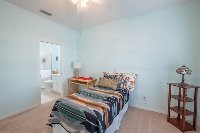 47 Summerwind Cir, Palm Coast, FL 32137 - bedroom featuring light colored carpet, ensuite bathroom, and ceiling fan