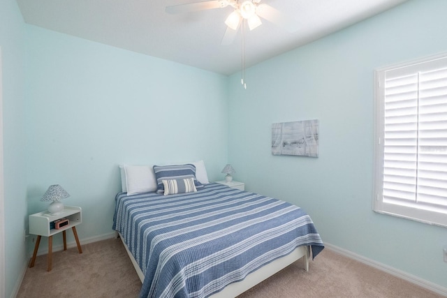 47 Summerwind Cir, Palm Coast, FL 32137 - carpeted bedroom with baseboards and ceiling fan