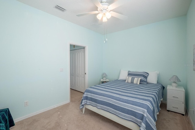 47 Summerwind Cir, Palm Coast, FL 32137 - bedroom featuring light carpet, ceiling fan, and a closet