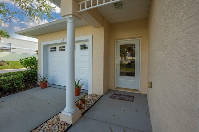 47 Summerwind Cir, Palm Coast, FL 32137 - view of exterior entry with stucco siding