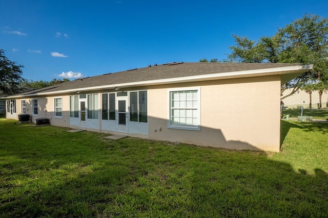 47 Summerwind Cir, Palm Coast, FL 32137 - back of property with a lawn and stucco siding