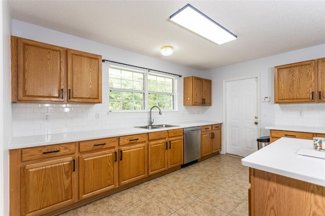 32 Karas Trl, Palm Coast, FL 32164 - kitchen featuring stainless steel dishwasher, brown cabinetry, tasteful backsplash, light countertops, and a textured ceiling